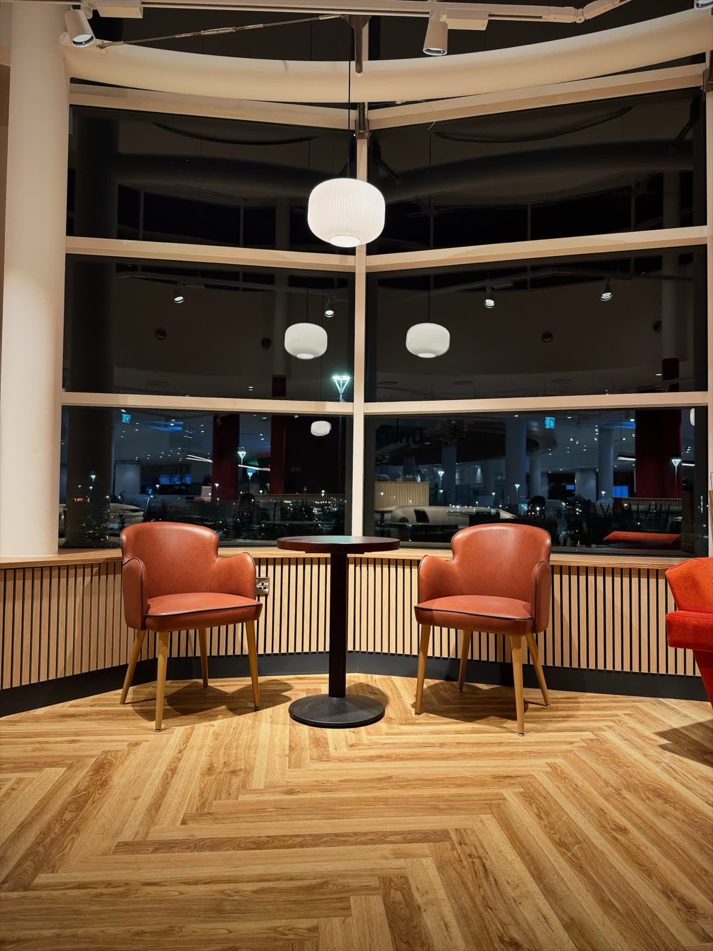 Window lounge seating with overhead globe pendant light at Insomnia Coffee Liffey Valley