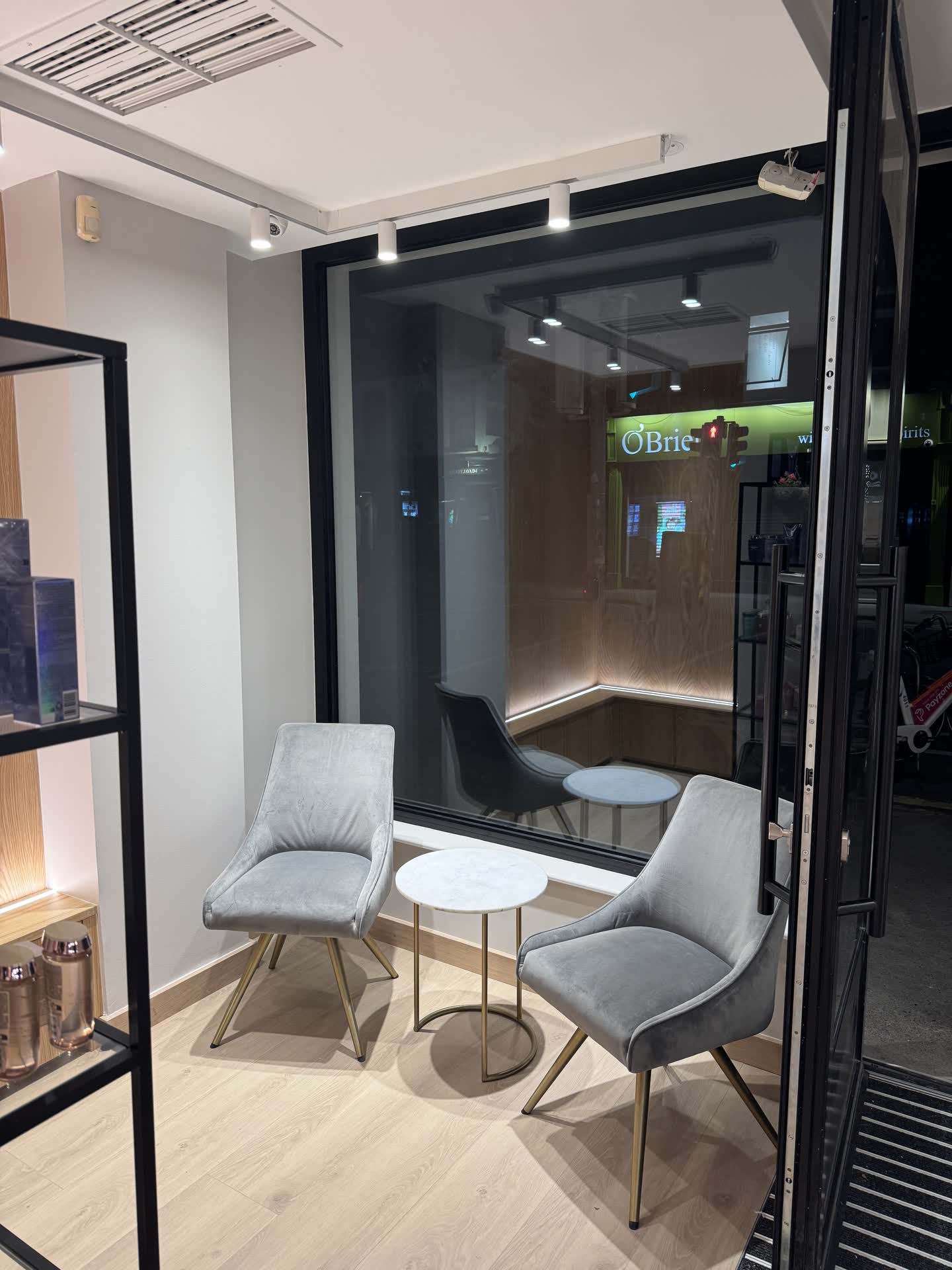 Zebra Hair Dressers reception and waiting area with recessed downlights and floor-to-ceiling window